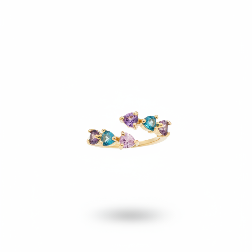 Gold ring with multicolored gemstones on a white background